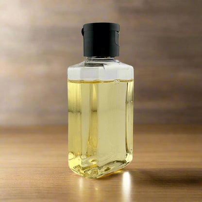 Clear shampoo bottle with black cap, filled with pale yellow liquid