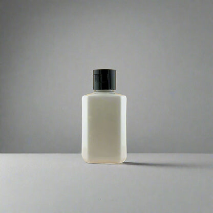Lotion bottle with black pump dispenser, front-facing bottle view