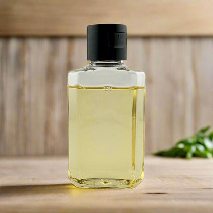 Liquid hand soap bottle with black pump, clear yellow liquid close-up