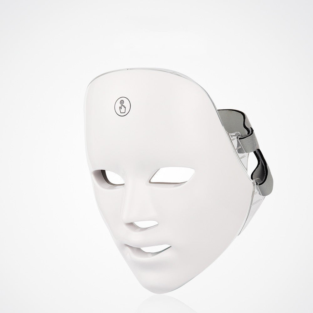 White LED beauty mask with facial cutouts and adjustable side strap