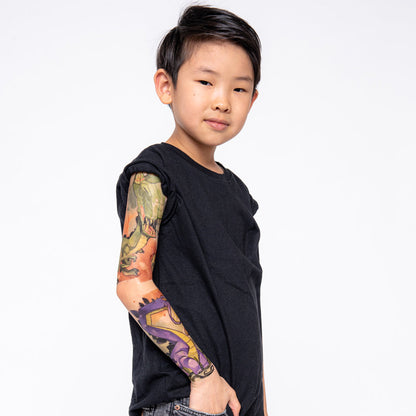 Kids temporary dinosaur tattoo sleeve, side view with green and purple dinosaur art