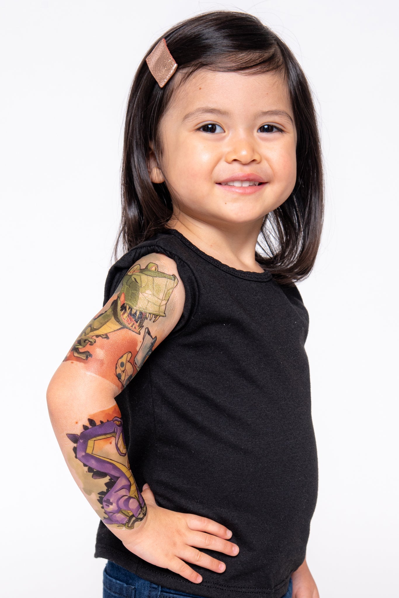 Kids temporary dinosaur tattoo sleeve, colorful dinosaur artwork on bent arm
