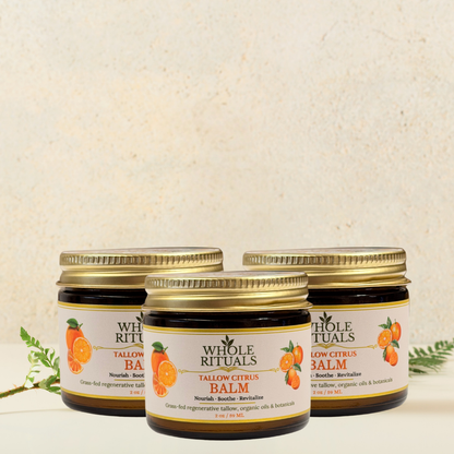 Three tallow citrus balm jars with gold lids, Whole Rituals citrus labels, clustered view