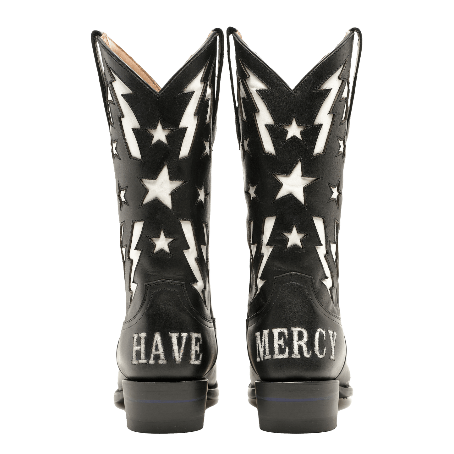 Pair of black cowboy boots showing white star and lightning graphics at back