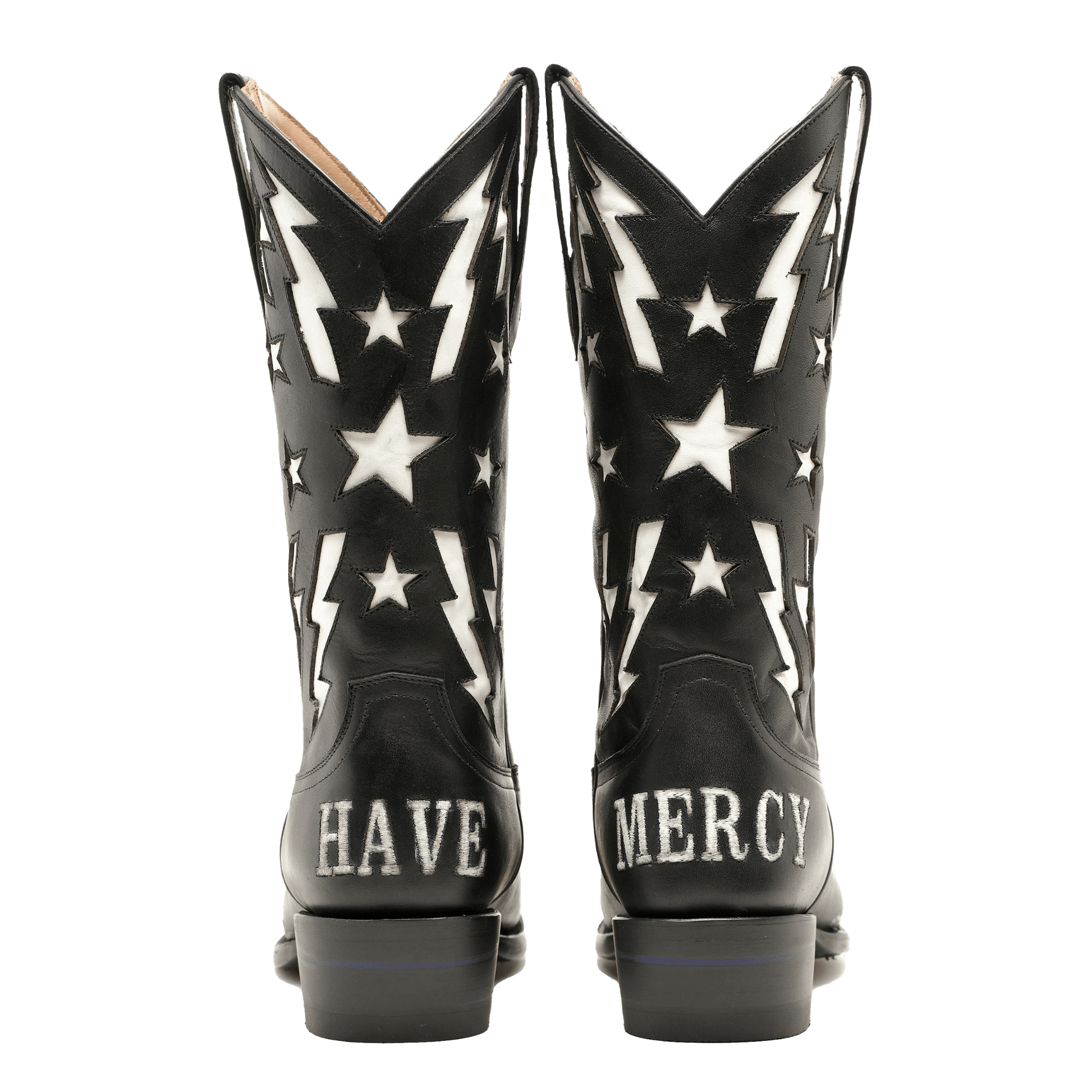 Pair of black cowboy boots showing white star and lightning graphics at back
