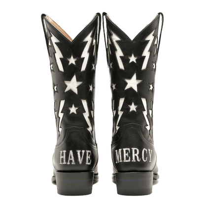 Pair of black cowboy boots showing white star and lightning graphics at back