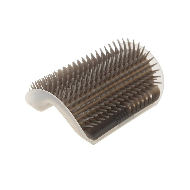 Brown corner grooming brush with dense bristles and a white mounting base.