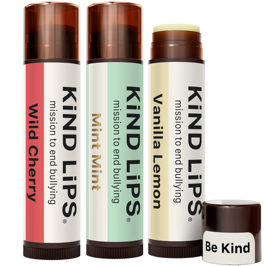 Three Kind Lips lip balm tubes with assorted colored sleeves and brown caps