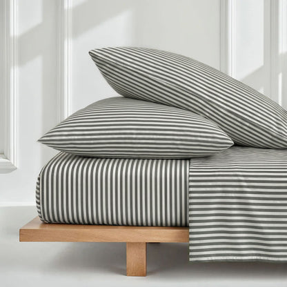 Striped bedding set with folded duvet and two matching pillow shams
