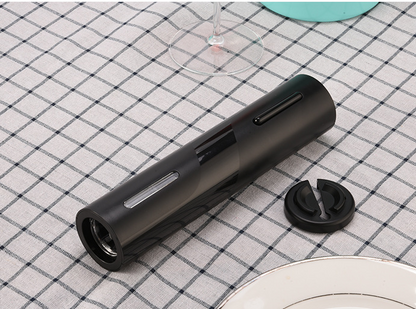 Black automatic wine bottle opener with corkscrew shaft and detachable foil cutter