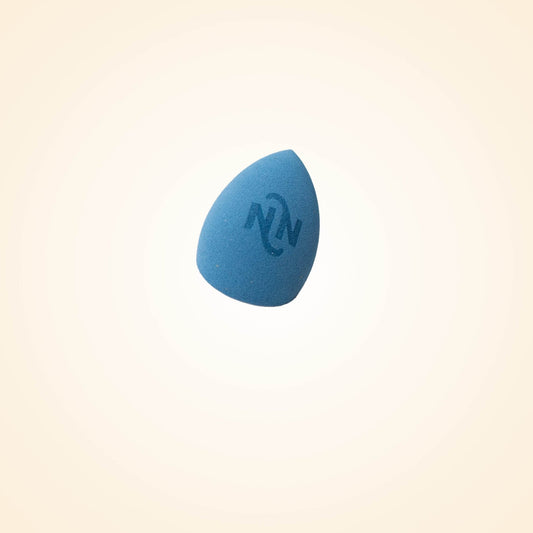 Blue triangular makeup sponge, branded surface for blending and dabbing.