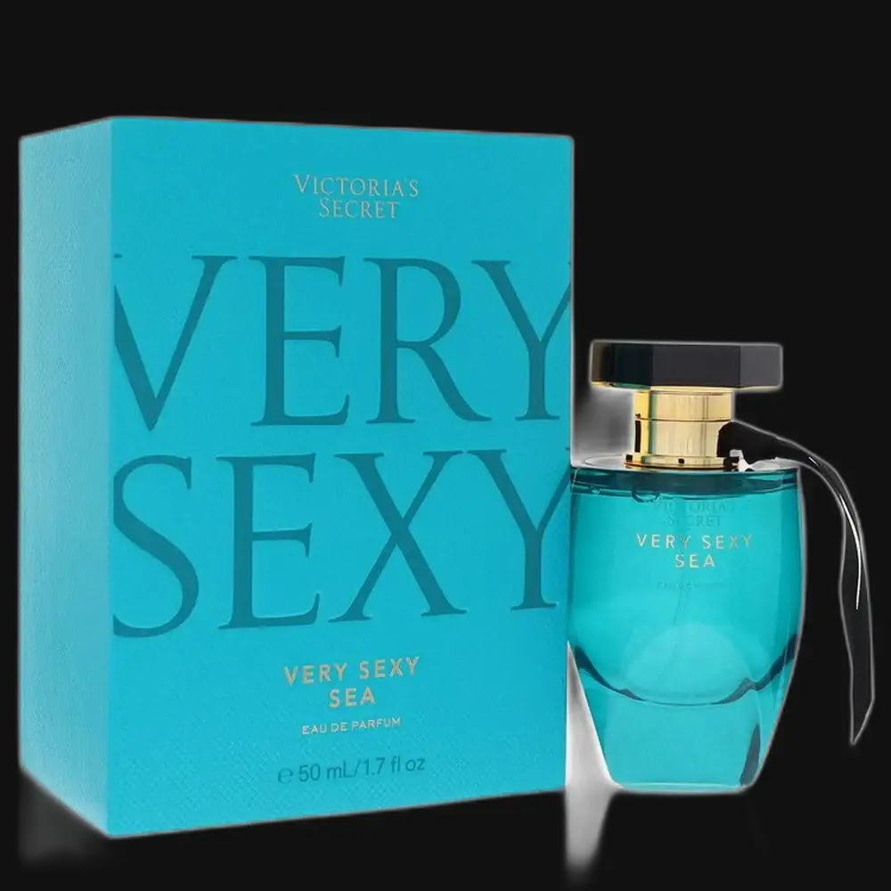 Women's perfume bottle, teal glass with black cap and gold collar, with box