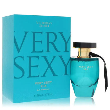 Women's perfume bottle, teal glass with black cap and gold top, with box