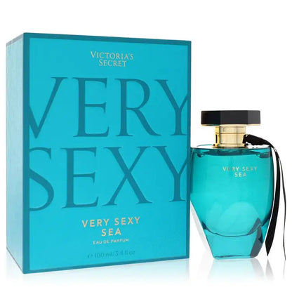 Women's perfume bottle with teal glass and black cap, beside teal Victoria's Secret box