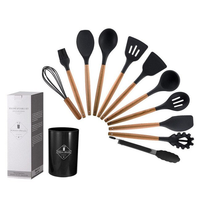 Black silicone cooking utensil set with wooden handles, plus storage cup and box