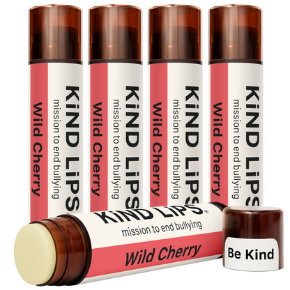 Multiple Wild Cherry lip balm tubes with one open stick and matching cap.