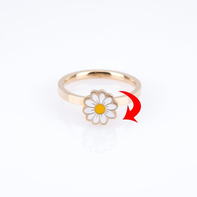 Rotatable daisy fidget spinner ring showing circular spinning motion