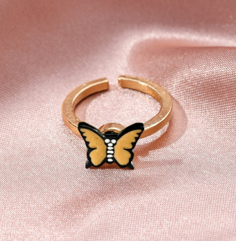 Gold fidget spinner ring with butterfly charm in yellow and black