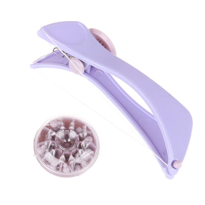 Purple hair remover tool with clamp-style head and round accessory with pins