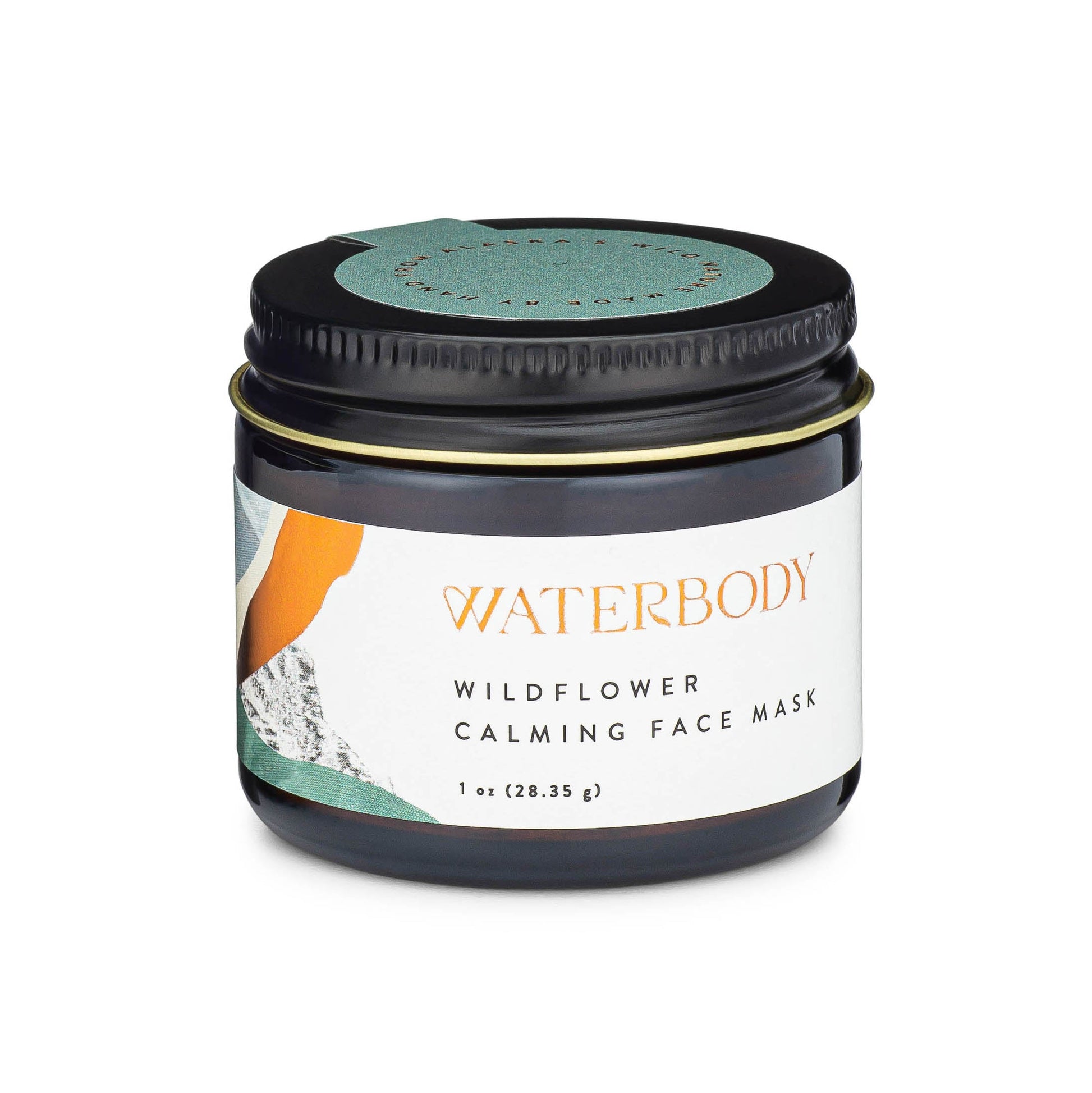 Calming face mask jar with white label, dark lid, and teal inner circle