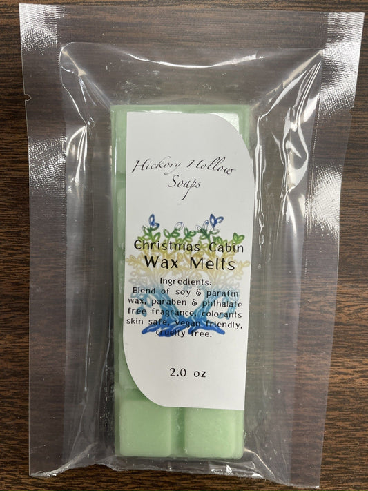Green Christmas Cabin wax melt snap bars in clear plastic packaging, labeled "Wax Melts"