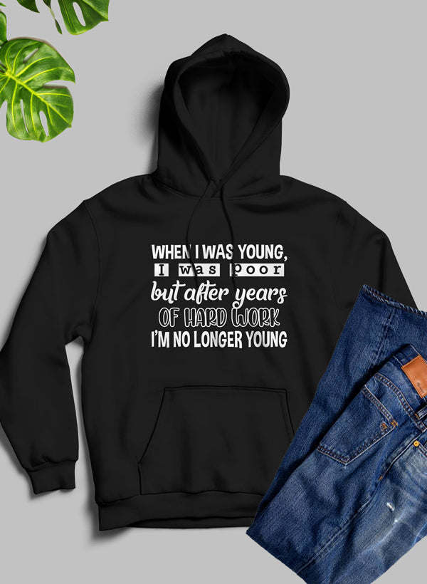 Black hoodie with hood, kangaroo pocket, and bold chest graphic text.