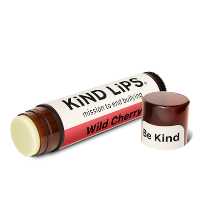 Wild Cherry lip balm tube with matching cap, shown with open lip balm stick.