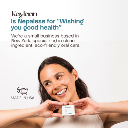 Mouthwash tablets container held by a smiling woman