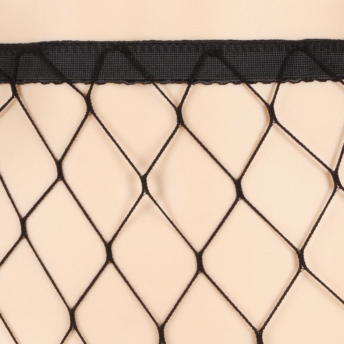 Black waistband and diamond fishnet pattern on sheer tights