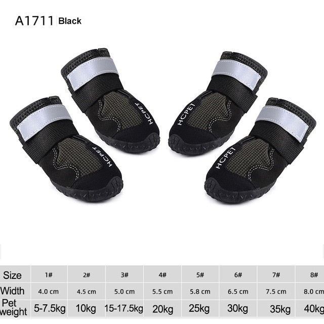 Black waterproof dog boots with silver reflective straps and textured rubber soles