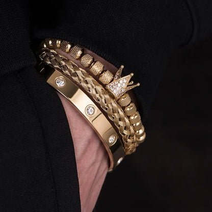 Gold braided Roman bracelet with diamond studs and crown centerpiece