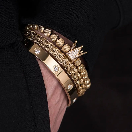 Gold braided Roman bracelet with diamond studs and crown centerpiece