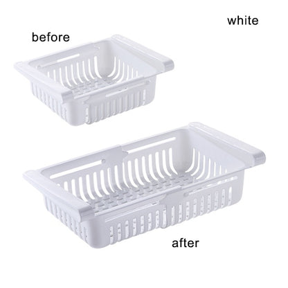 White plastic kitchen shelf organizer basket with side handles and slotted base