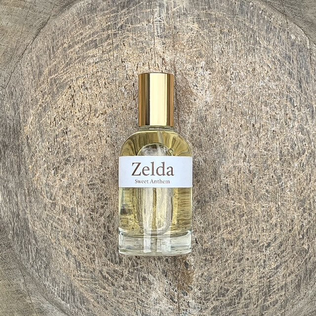 Zelda Sweet Anthem perfume bottle with gold cap and clear glass sprayer