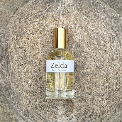 Zelda Sweet Anthem perfume bottle with gold cap and clear glass sprayer