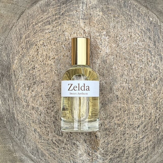 Zelda Sweet Anthem perfume bottle with gold cap and clear glass sprayer