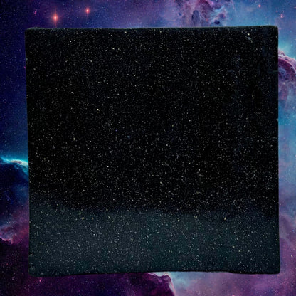 Zero Gravity soap bar, dark blue speckled square face, flat top view