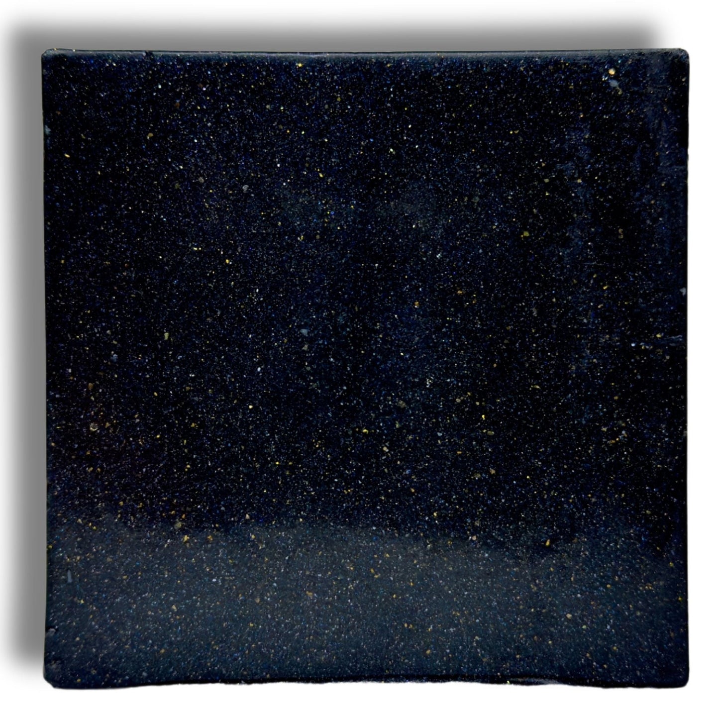 Zero Gravity soap bar, close-up dark blue speckled square surface
