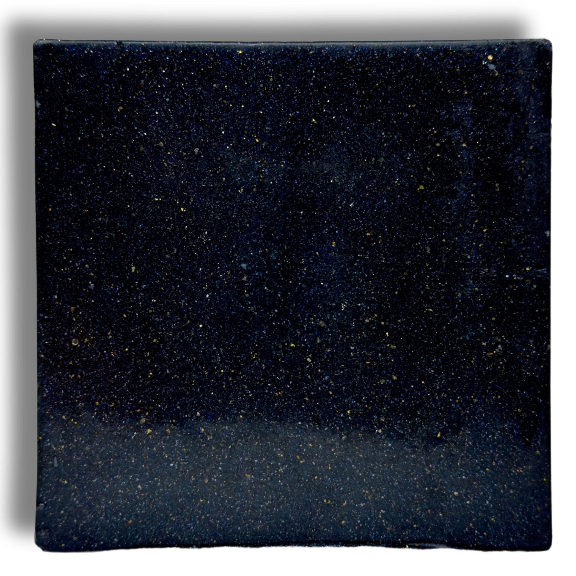 Zero Gravity soap bar, close-up dark blue speckled square surface