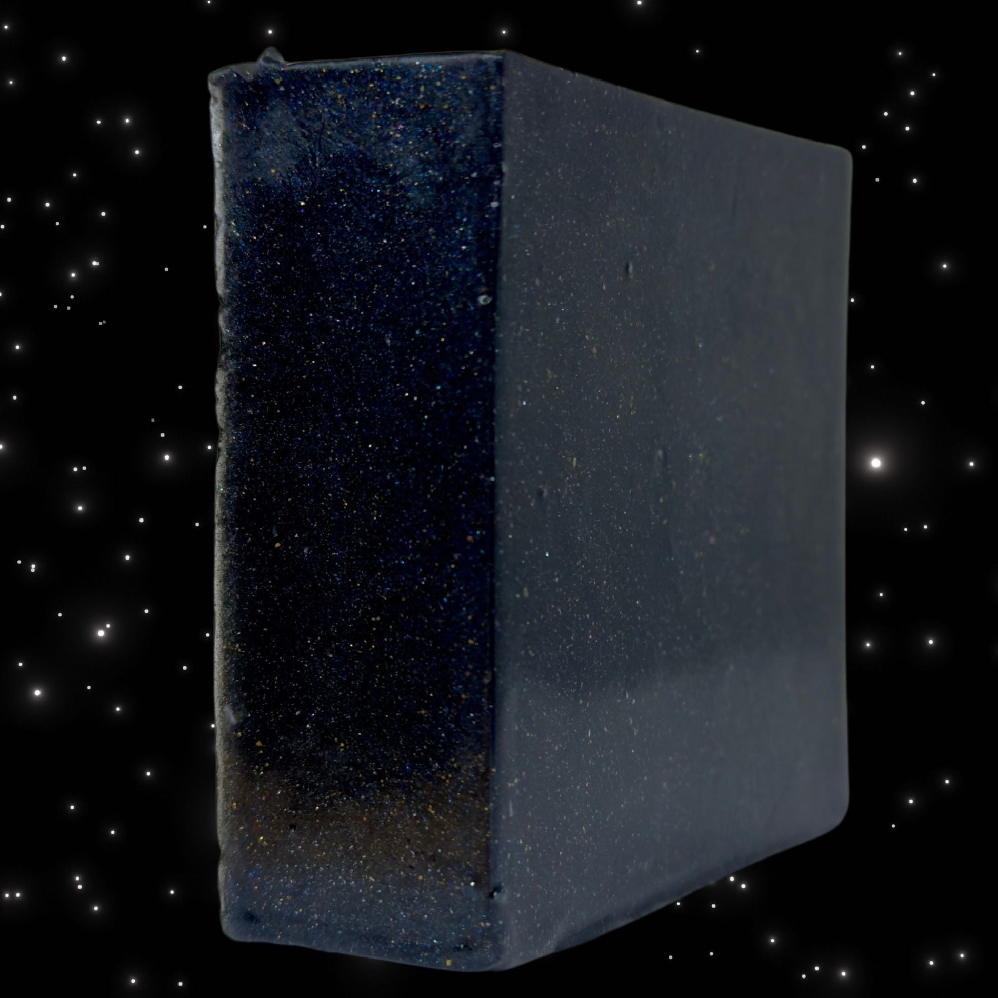 Zero Gravity soap cube, dark blue speckled cube with rounded edges, side view