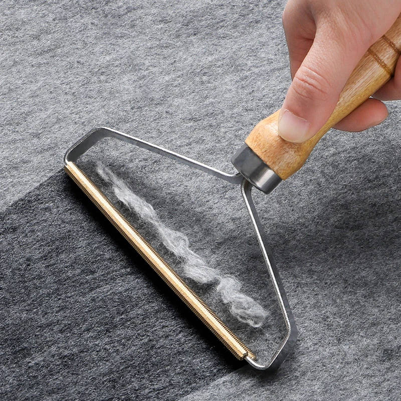 Wood-handled pet hair lint remover brush with metal frame and bristles