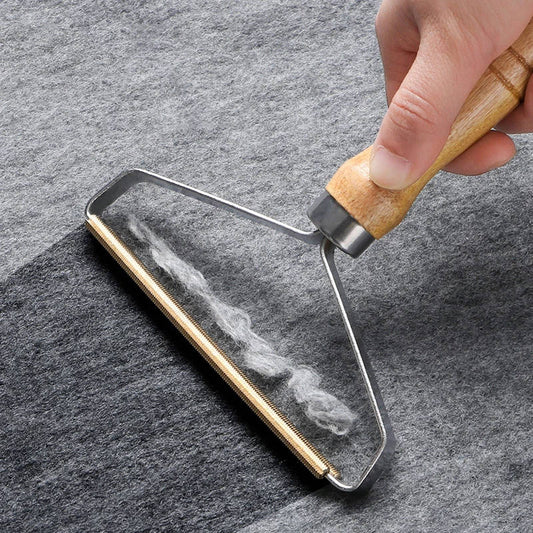 Wood-handled pet hair lint remover brush with metal frame and bristles
