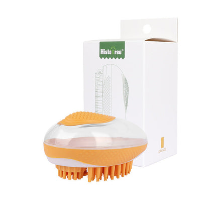 Orange pet bath brush with silicone bristle pad, packaged in retail box