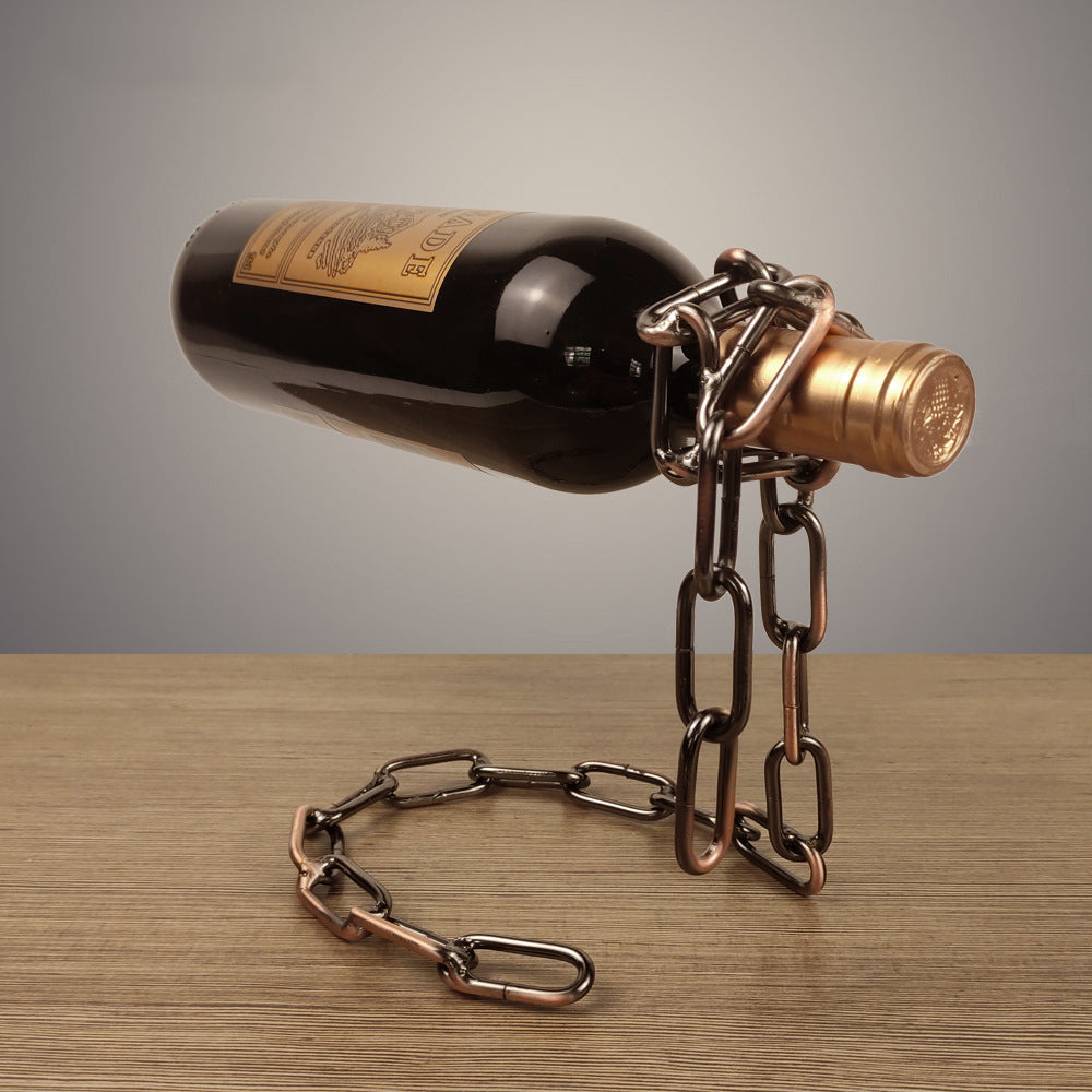 Wine bottle holder with dark bottle and bronze chain links with hook clamp