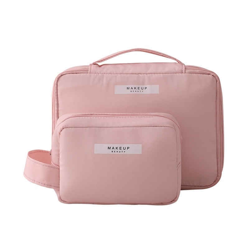 Pink cosmetic bag with top handle and front organizer pouch