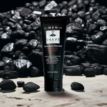 Charcoal face wash tube, dark gray squeeze gel, black flip-cap