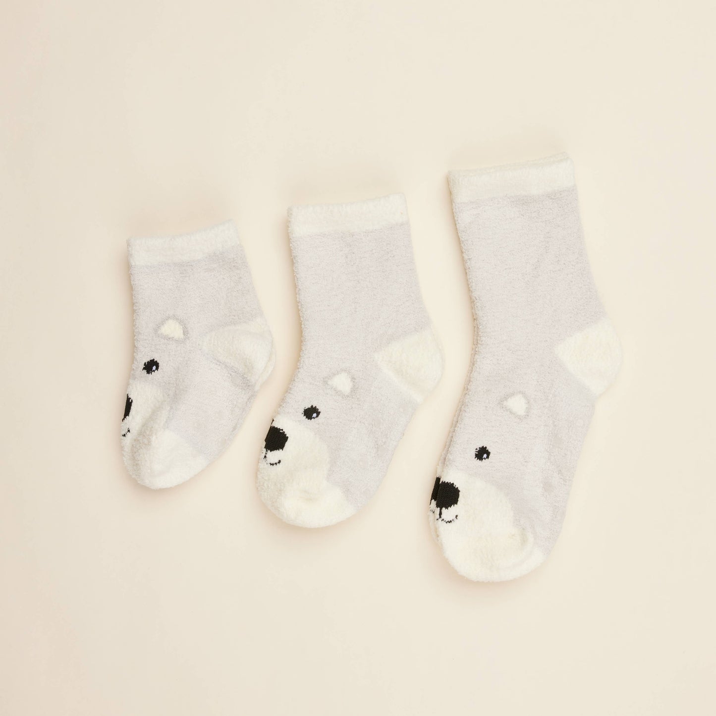 Set of cream crew socks; lilac stripe cuffs and bear face details, three pairs shown