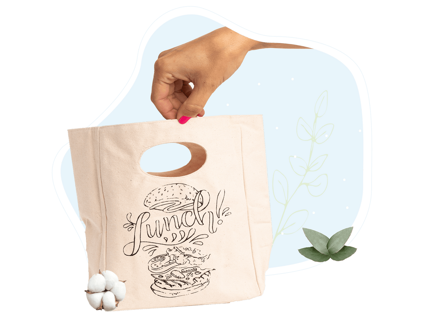 Canvas lunch bag in hand with “Lunch!” graphic and oval cutout handle
