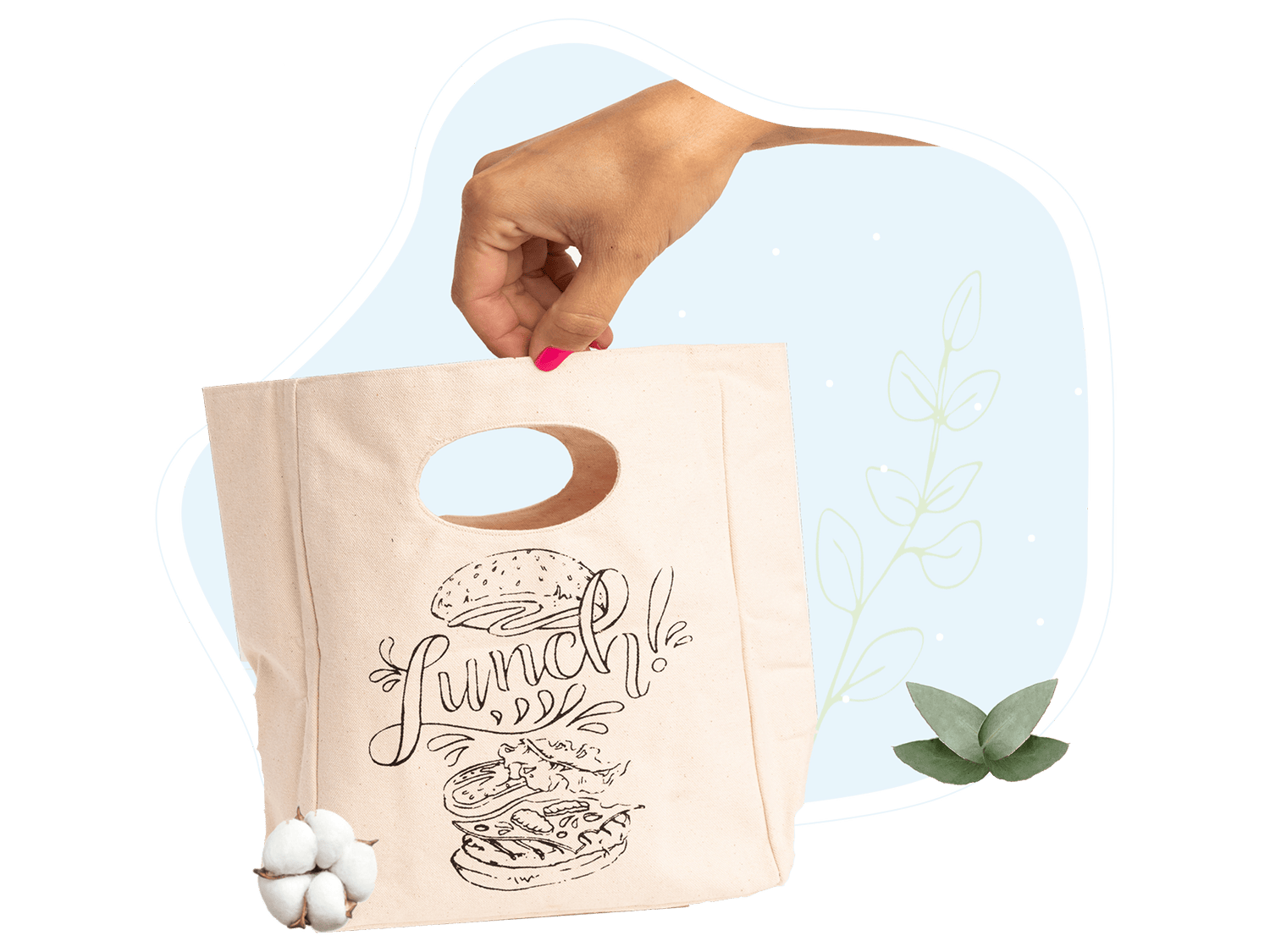 Canvas lunch bag in hand with “Lunch!” graphic and oval cutout handle