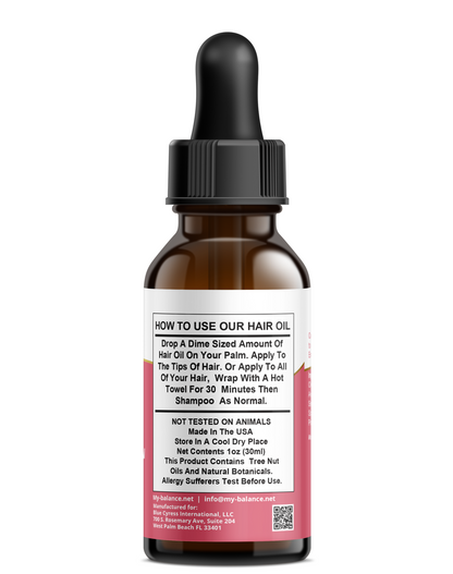 Argan topical oil bottle with black dropper cap, amber glass, info label
